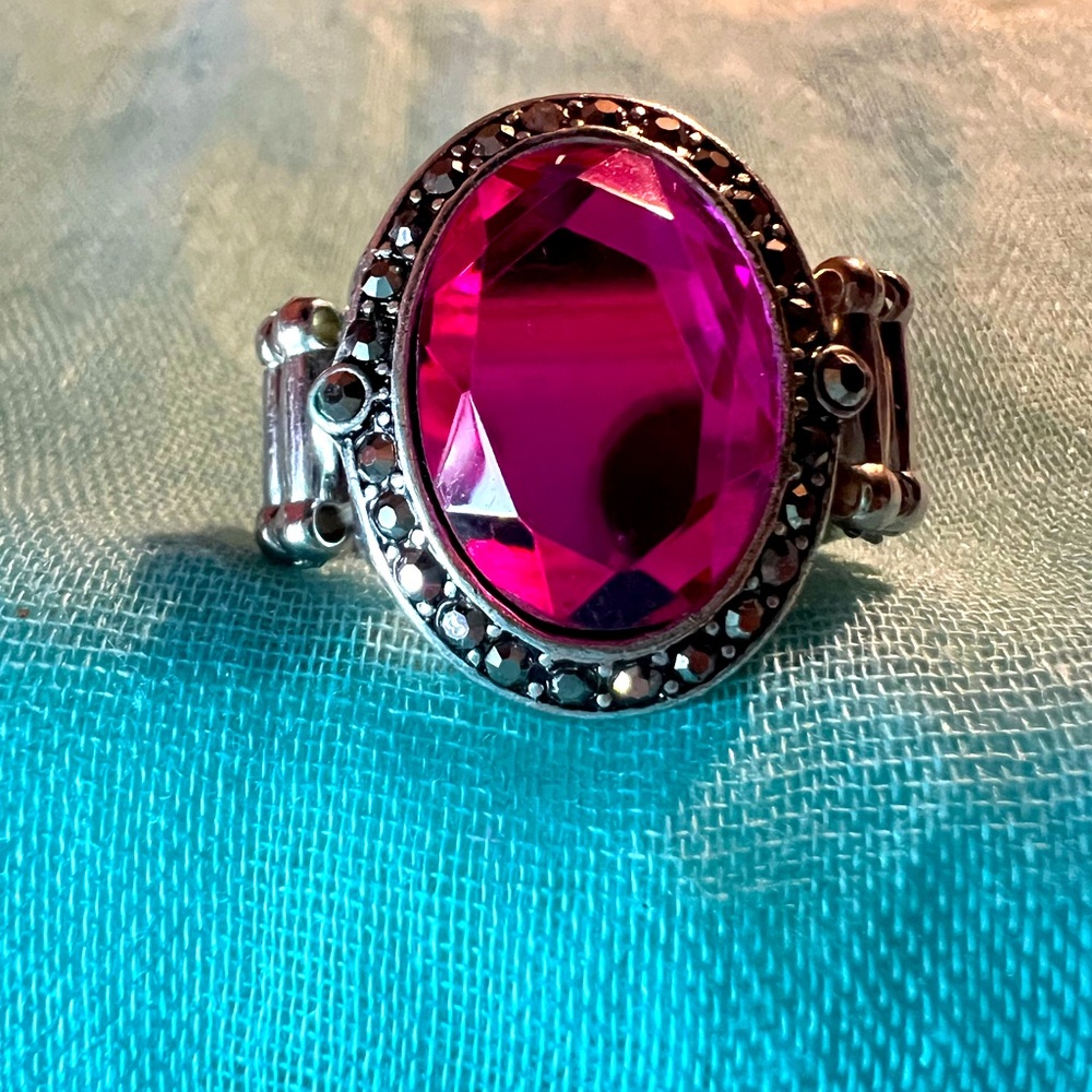 Stunning pink stone sits in the middle of this expandable ring!